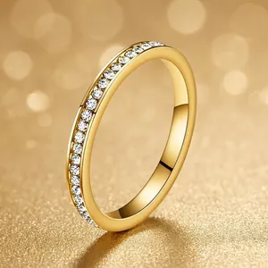 Close-up detail of a 2mm gold-plated titanium steel ring with sparkling small diamonds