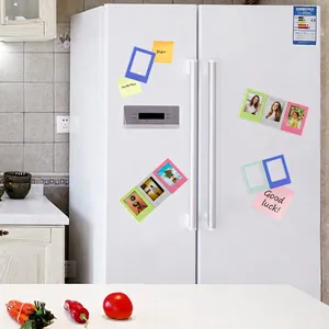 Detailed view of colorful 3-inch magnetic mini photo frames displayed on a white refrigerator door