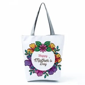 White canvas tote bag featuring a colorful floral wreath and Happy Mother's Day print