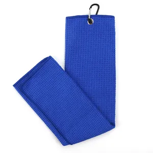 Blue microfiber golf towel with waffle weave texture and black carabiner hook
