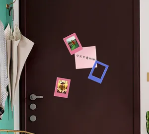 Colorful 3-inch magnetic photo frames for Instax mini photos displayed on a metal surface