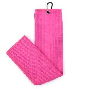 Detailed close-up of a pink waffle-weave microfiber golf towel with a black carabiner clip.