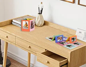 Vibrant and colorful 3-inch magnetic photo frames for Polaroid pictures on a desk