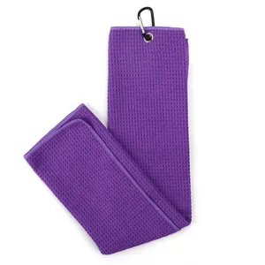 Purple microfiber golf towel with a waffle weave pattern and black carabiner clip attachment