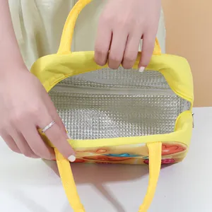 Yellow insulated lunch bag with thick aluminum foil lining for student or office use.