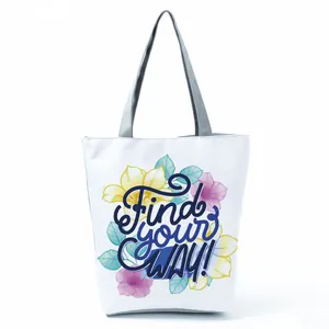 Floral print tote bag featuring stylized Find your WAY text on a white canvas background