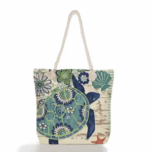 Nautical sea turtle print canvas tote bag with thick rope handles for beach use