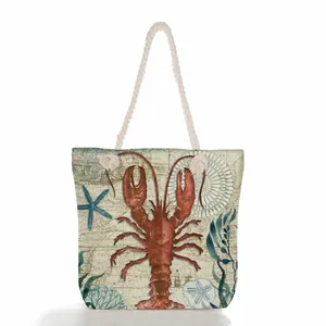 Vintage nautical lobster print canvas tote bag with thick rope handles and sea motifs