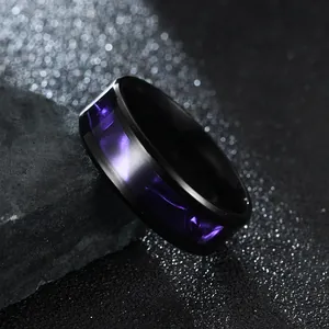 Macro close-up view of 8mm black stainless steel ring with purple galaxy inlay pattern for men