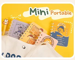 Detail view of colorful A7 mini spiral notebooks with cute cartoon covers inside a bag