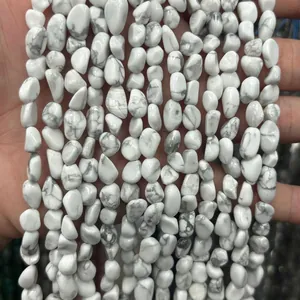 Detailed macro view of natural white howlite irregular stones for jewelry making