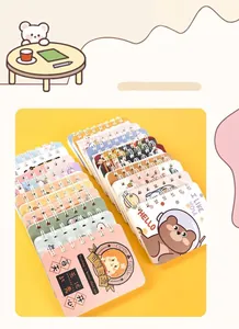 Detailed view of multiple colorful A7 mini spiral notebooks featuring cute cartoon cover designs