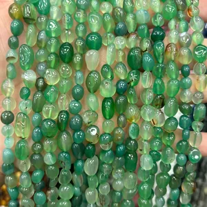 Macro view of translucent green natural stone irregular chip beads for DIY jewelry