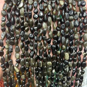 Close-up of polished irregular black natural stones for DIY jewelry making and bead craft projects