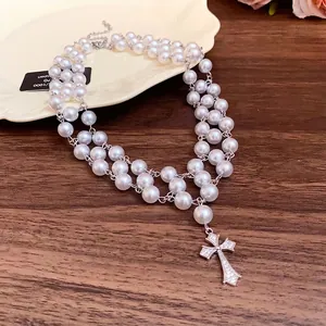 Elegant double-strand pearl necklace with a sparkling zircon cross pendant jewelry