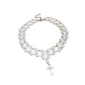 Elegant double-layered pearl choker necklace featuring a zircon encrusted cross pendant