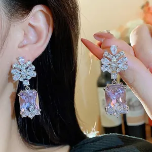 Palace style silver needle earrings with large purple square zircon and floral design