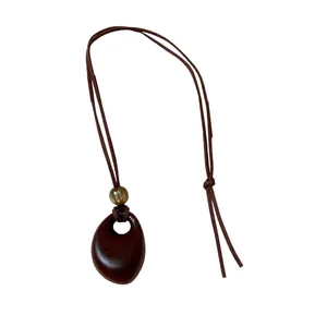Retro wax cord necklace featuring an irregular brown oval pendant for women