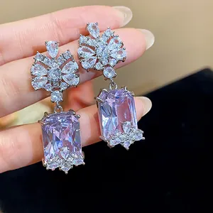 Detailed view of exquisite purple rectangular zircon drop earrings with floral top
