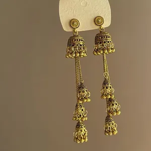 Vintage golden tiered bell tassel earrings with a light luxury antique metallic finish