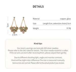 Detailed spec view of butterfly drop earrings with size and material information