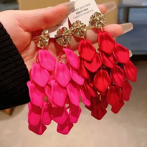 Exaggerated magenta and red petal tassel dangle earrings with unique gold stud accents
