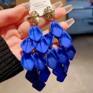 Detailed view of vibrant blue petal tassel earrings with a 925 silver needle hangtag