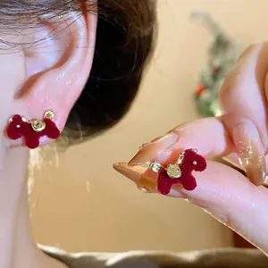 Retro red flocked horse stud earrings with silver needles for a high-end festive look.