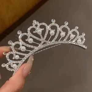 Exquisite close-up of a sparkling silver bridal tiara adorned with pearls and rhinestones