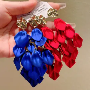Close-up of vibrant blue and red petal tassel earrings featuring elegant gold-toned tops