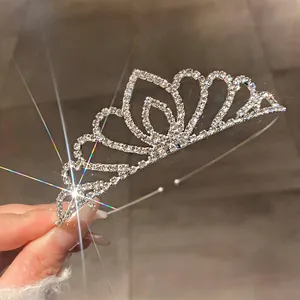 Close-up of sparkling rhinestone bridal tiara crown with elegant wavy design