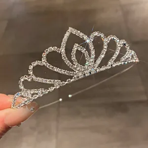 Close-up detail of a sparkling silver rhinestone bridal tiara with elegant heart design