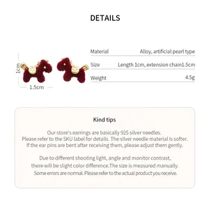 Detailed view of red flocked pony earrings with size and material specifications