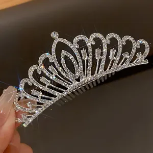 Close-up detail of an elegant silver bridal tiara hair comb with sparkling rhinestones