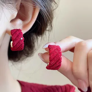 Vintage red flocked C-shaped hoop earrings with elegant quilted texture for autumn and winter