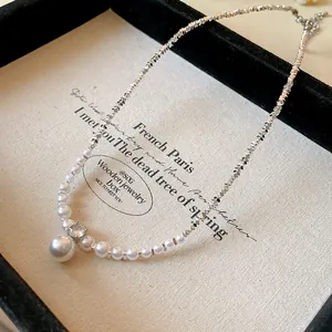 Exquisite detail of a French style necklace with zircon, pearls and crushed silver beads.