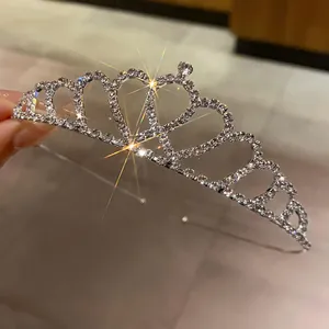 Close-up macro view of a sparkling heart-shaped rhinestone bridal crown tiara for weddings