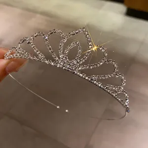Detail view of sparkling silver rhinestone bridal tiara with elegant heart-shaped design