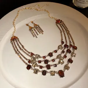 Vintage style multi-layer necklace and matching earring set with amber oval rhinestones