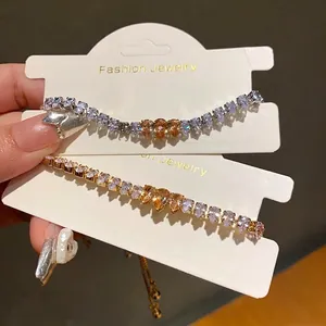 Elegant zircon waterdrop bracelets in gold and silver finishes, 80-100 characters.