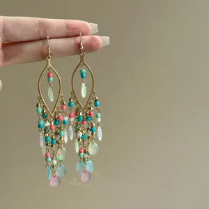 Detailed view of Bohemian glass bead tassel earrings with colorful drop pendants.