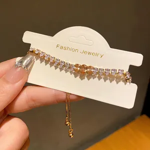 Elegant gold-plated bracelet with pear-shaped champagne zirconia and adjustable bolo clasp