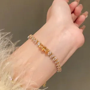 Detailed close-up of a luxury teardrop zircon bracelet with amber and clear crystals