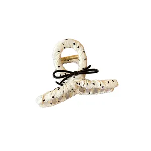 French style polka dot fabric wrapped hair claw clip with black bow detail