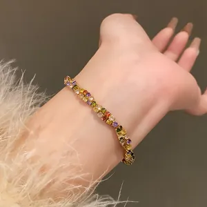 Detailed close-up of a vibrant multi-color zircon bracelet worn on a wrist for elegant style