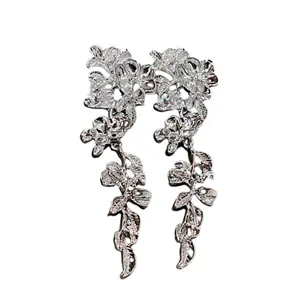 Elegant silver metal flower tassel earrings with a long hanging leaf drop design