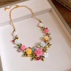 Detailed view of pastoral style floral necklace with multi-color roses and rhinestones