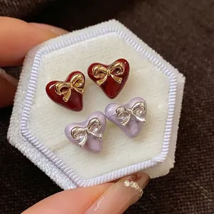 Exquisite gold-plated heart-shaped bowknot stud earrings in deep red and lavender pearl