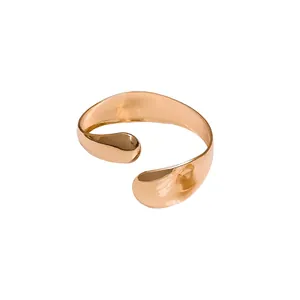 Elegant minimalist irregular smooth oval open-ended bracelet in polished gold finish design.