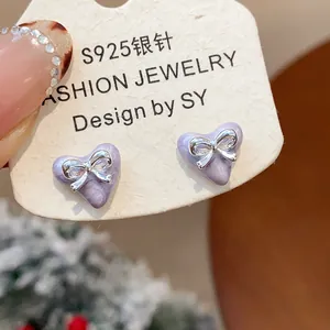 Detail of lavender heart earrings with silver bow accents and S925 silver needles